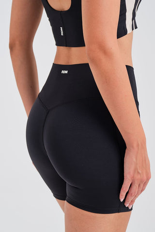 Leggings Cortos Negros con Bolsillos y Cintura Compresiva