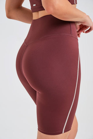 Leggings Ciclistas Burdeos con Cintura Compresiva y Detalle en Contraste